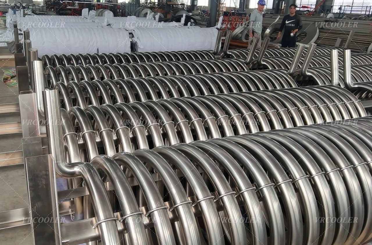 What factors are important when selecting a spiral coil heat exchanger for a boiler?